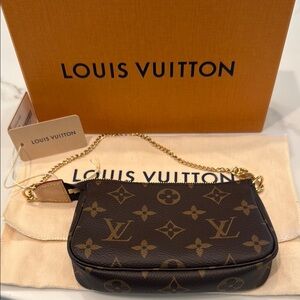 Louis Vuitton Black and Gold Monogram Clutch